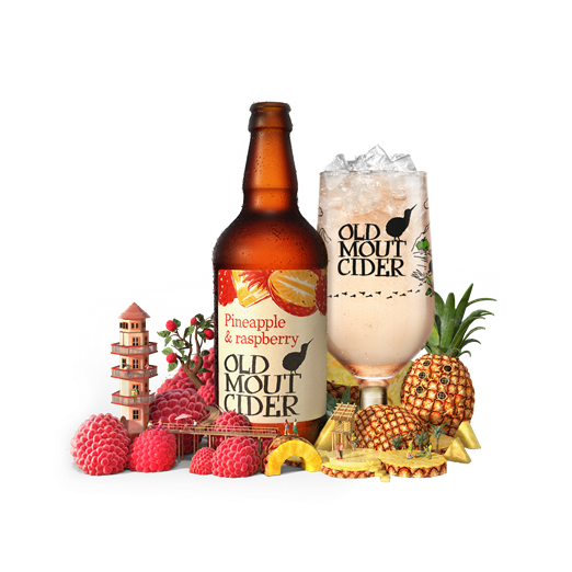 Old Mout Cider Pineapple and Raspberry Flavour bottle and glass surrounded by fruit